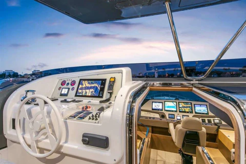 Upper helm station and forward seating area on the Ferretti 960 flybridge.