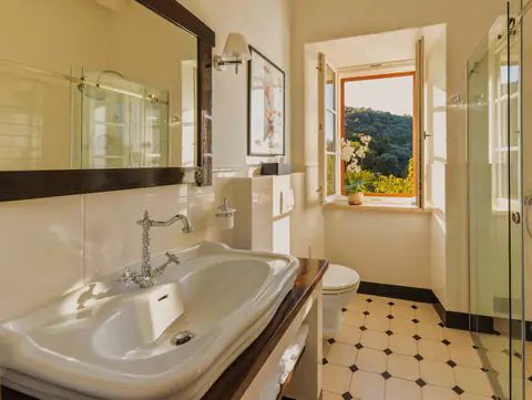 Bright double bedroom at Molonta Heritage Estate with garden views.