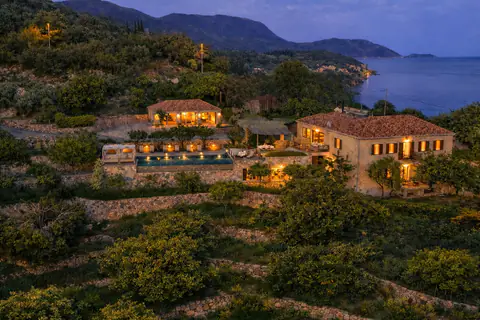 Aerial sunset view of Molonta Heritage Estate above the Adriatic.