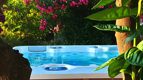 Molonta details arranged beside the turquoise infinity pool.