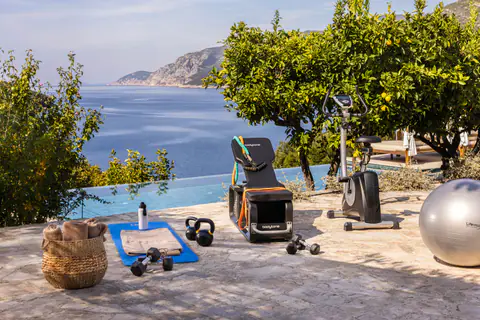 Stone seafront terrace overlooking the clear water of Molunat Bay.
