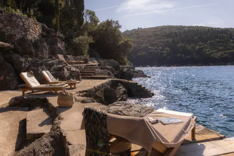 Stone pathway leading through the estate's waterfront terraces.