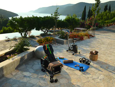 Stone garden terrace prepared as a quiet outdoor sitting area.