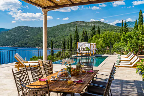 Infinity edge opening visually toward the Adriatic landscape.