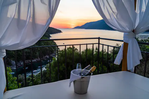 Upper terrace with a hammock and views across the estate.