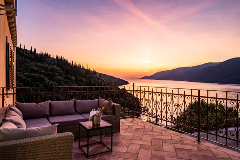 Terrace seating arranged for sunset above the water.