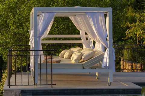 Poolside cabana prepared as a shaded outdoor retreat.