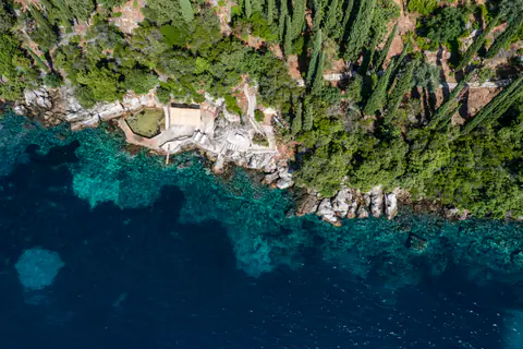 Aerial view of Molonta's secluded sea-access point and turquoise cove.